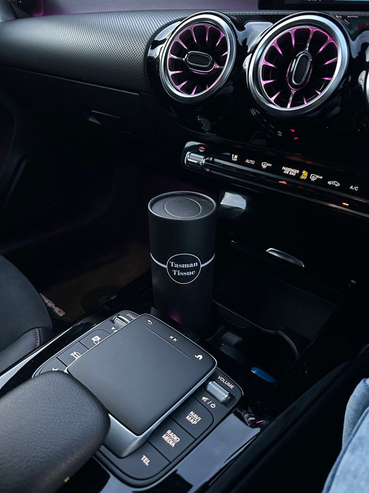 Paper tissue in black silver cylindrical container for desk and car