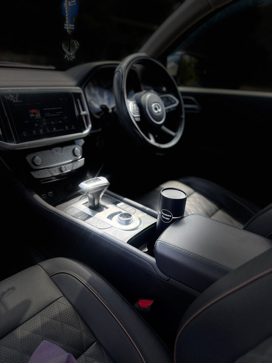 Paper tissue in black silver cylindrical container for desk and car